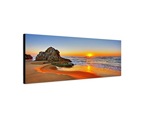 Paul Sinus Art Panoramabild auf Leinwand und Keilrahmen 150x50cm Strand Meer Sonnenaufgang Fels