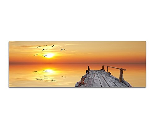Paul Sinus Art Panoramabild auf Leinwand und Keilrahmen 150x50cm Wasser Holzsteg Seevögel Sonnenuntergang