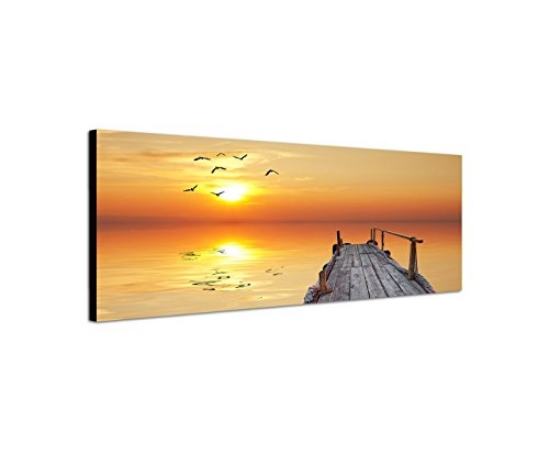 Paul Sinus Art Panoramabild auf Leinwand und Keilrahmen 150x50cm Wasser Holzsteg Seevögel Sonnenuntergang