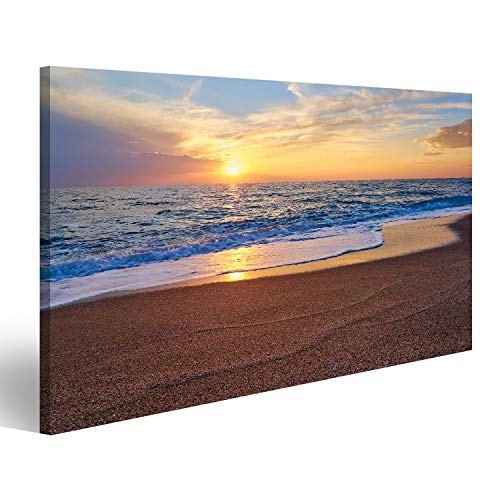 Bild Bilder auf Leinwand Bunter Sonnenuntergang an der tropischen Strandsonne hinter Wolken reflektiert auf Wasser und Wellen mit Schaumstoff auf Sand. Wandbild Poster Leinwandbild SDO