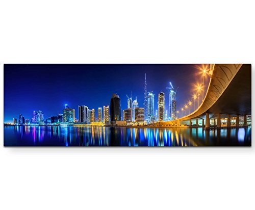 Panoramabild auf Leinwand in 150x50cm Skyline Dubai bei Nacht