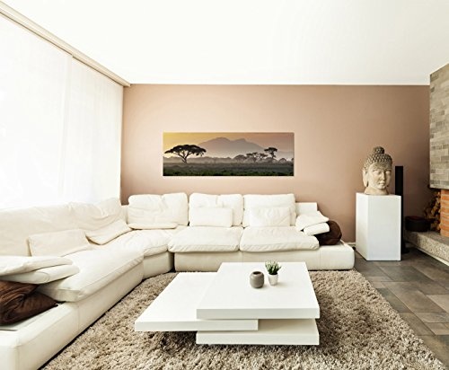 Wandbild auf Leinwand als Panorama in 120x40 cm Afrika bei Sonnenuntergang! Afrikanische Savanne mit Baum und Berge.Serengeti mit Graslandschaft.