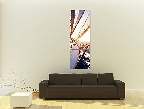 Wandbild - Yacht auf See - Bild auf Leinwand - 60x180 cm dreiteilig - Leinwandbilder - Urlaub, Sonne & Meer - Boot im Sonnenaufgang - Blick vom Deck