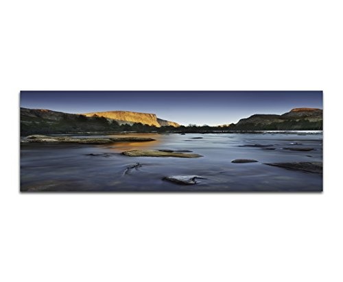 Wandbild auf Leinwand als Panorama in 150x50cm Felsen Bäume Fluss Steine Abendlicht