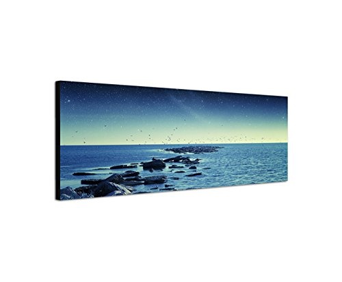 Wandbild auf Leinwand als Panorama in 150x50cm Meer Steine Vögel Morgengrauen Sterne