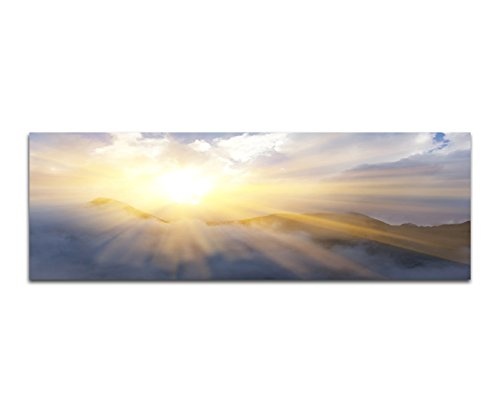 Wandbild auf Leinwand als Panorama in 150x50cm Berge Sonnenstrahlen Wolkenschleier