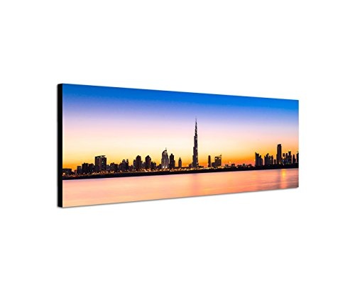 Wandbild auf Leinwand als Panorama in 150x50cm Dubai Skyline Wolkenkratzer Wasser Abendlicht