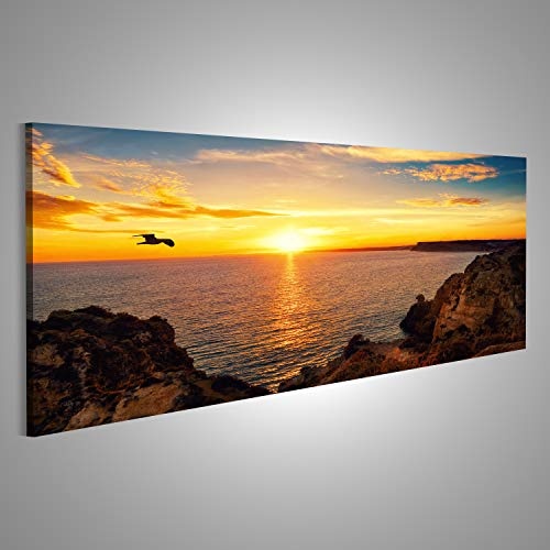 islandburner Bild Bilder auf Leinwand Ruhige Sonnenuntergang Landschaft am Meer mit dem Sonnenlicht spiegelt Sich auf dem Wasser, EIN Fliegender Vogel und die felsige Küste Wandbild, Poster,